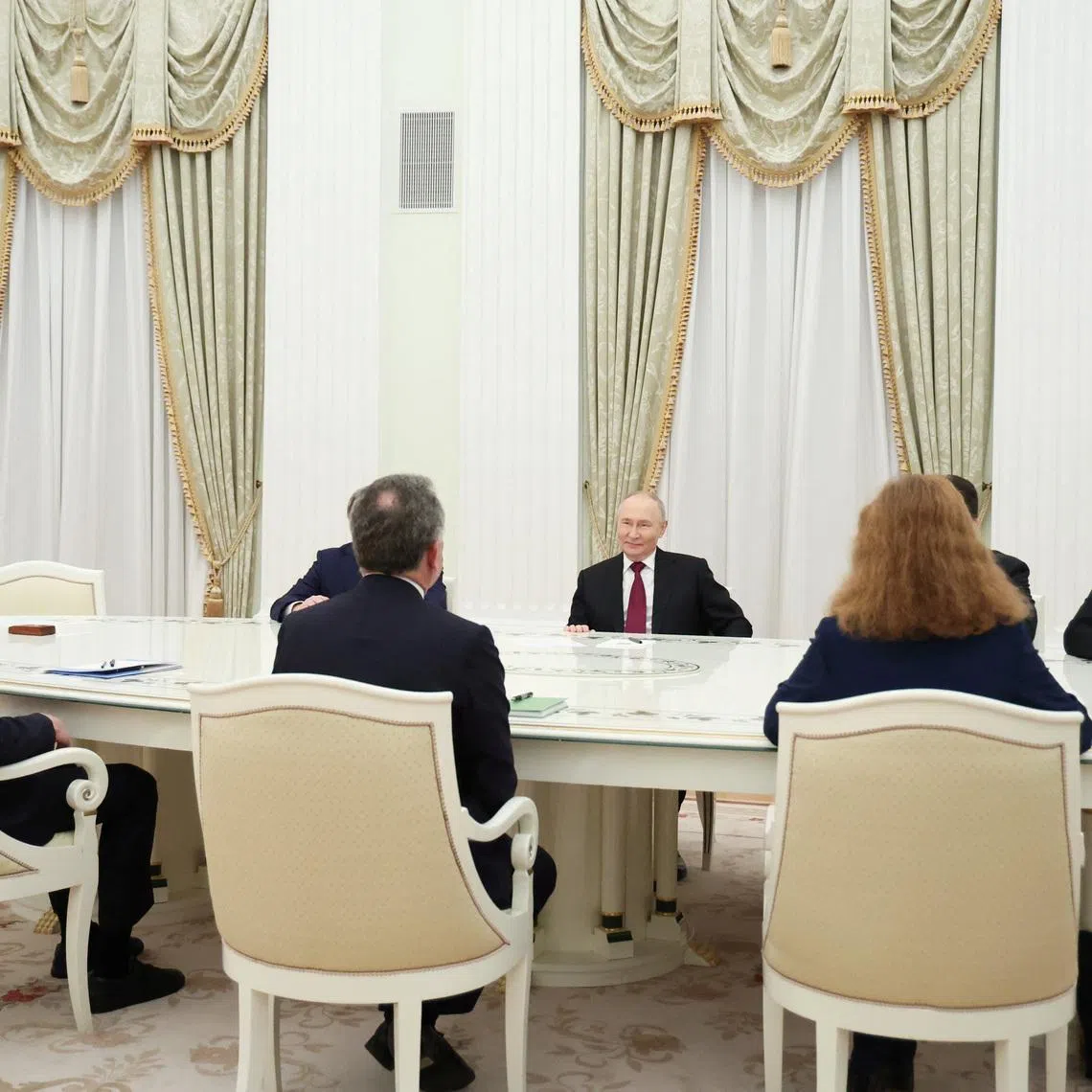 Russian President Vladimir Putin, presidential envoy Kirill Dmitriev and foreign policy aide Yuri Ushakov attend a meeting with U.S. President Donald Trump's special envoy Steve Witkoff and son-in-law Jared Kushner at the Kremlin in Moscow, Russia, December 2, 2025. Sputnik/Alexander Kazakov/Pool via REUTERS