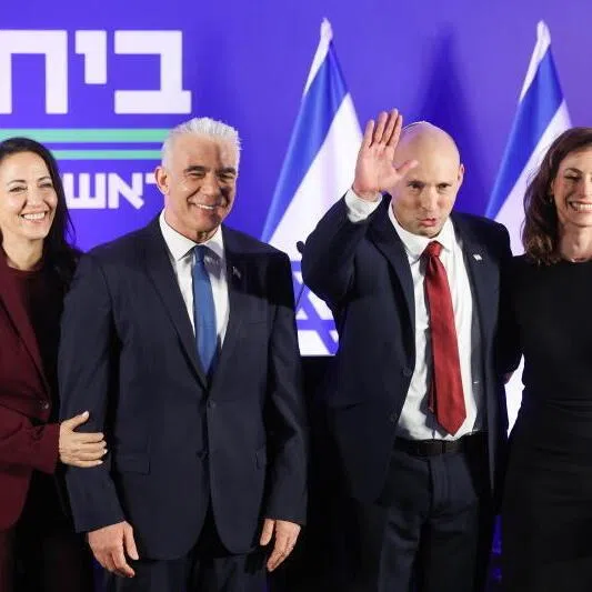 Former Israeli prime ministers Naftali Bennett (second from right) and Mr Yair Lapid, accompanied by their wives at a joint press conference in Herzliya, Israel, on April 26.