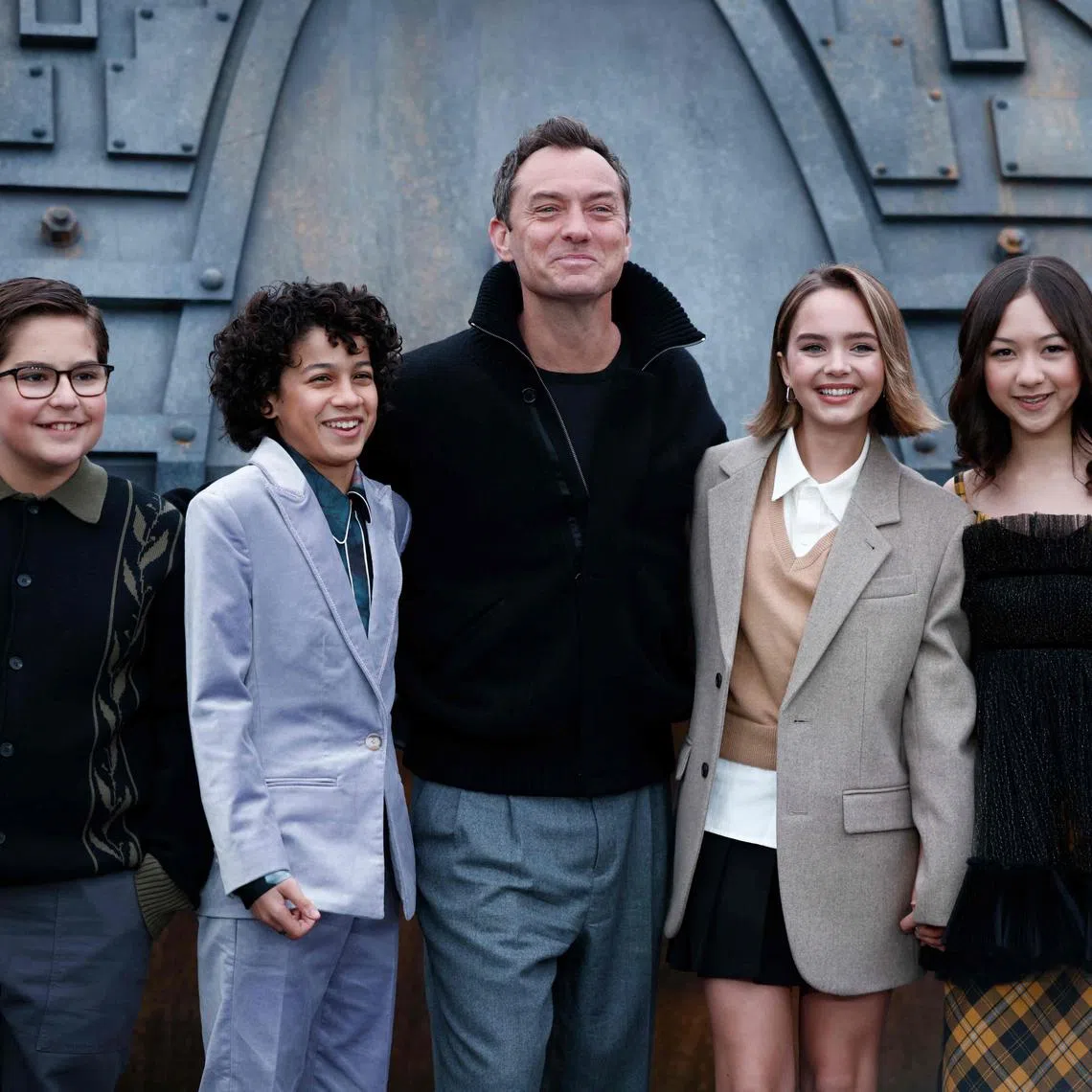 British actor Jude Law (centre) with co-stars (from left) Robert Timothy Smith, Ravi Cabot-Conyers, Ryan Kiera Armstrong and  Kyriana Kratter, during a Star Wars: Skeleton Crew photo call in London.