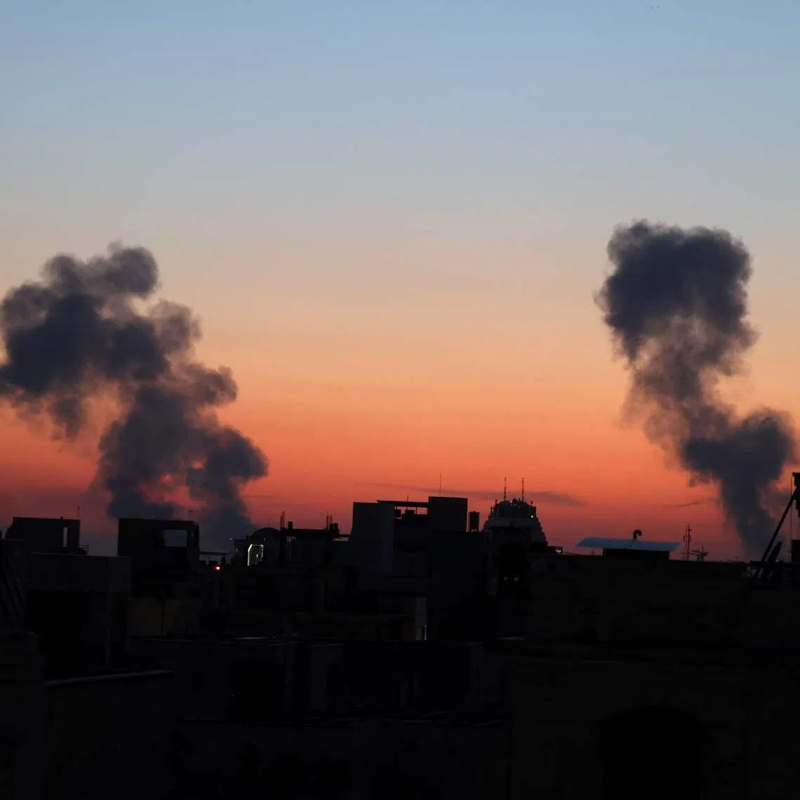 Black plumes of smoke ascends from the site of an air strikes in a central area of the Iranian capital Tehran on March 6.