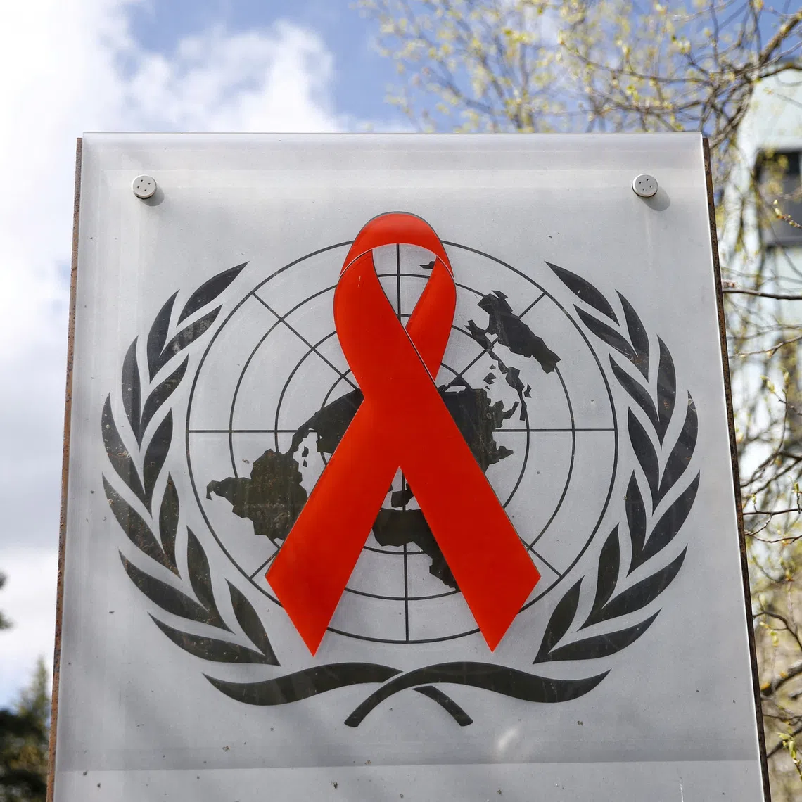 FILE PHOTO: A logo is pictured outside a building of the United Nations AIDS agency (UNAIDS) in Geneva, Switzerland, April 6, 2021/Denis Balibouse/File Photo