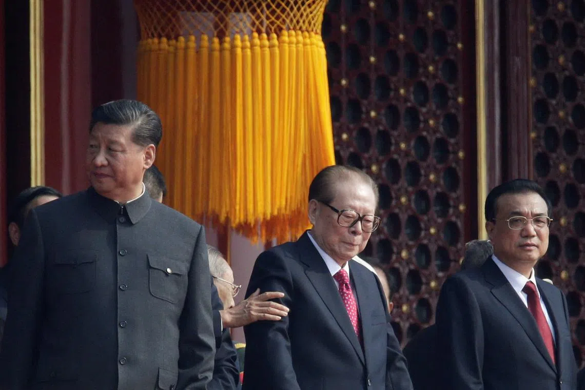 Chinese President Xi Jinping stands next to former president Jiang Zemin and premier Li Keqiang on Tiananmen Gate before the military parade marking the 70th founding anniversary of People's Republic of China, on its National Day in Beijing, China on Oct 1, 2019. 