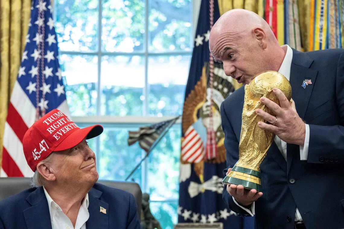 US President Donald Trump, seen here with Fifa chief Gianni Infantino, is set to be in the spotlight when the World Cup draw takes place in Washington.
