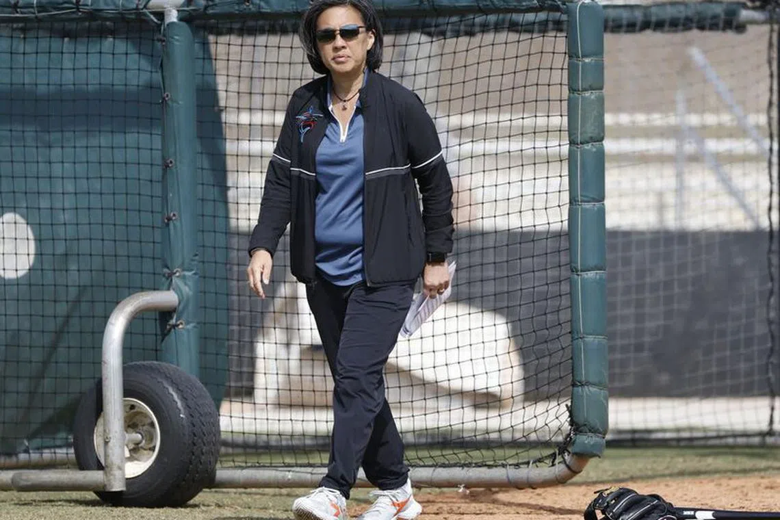 Feb 18, 2023; Jupiter, FL, USA;  Miami Marlins general manager Kim Ng watches drills during workouts at the Marlins practice facility.. Mandatory Credit: Rhona Wise-USA TODAY Sports/File Photo