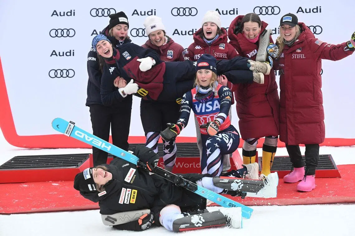 American winner Mikaela Shiffrin reacts as she celebrates with her team after the Women's slalom event of FIS Alpine Skiing World Cup in Spindleruv Mlyn, Czech Republic on Jan 25, 2026.