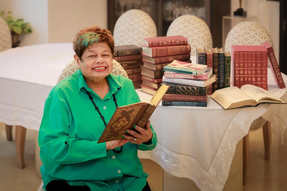 Zaibun Siraj, founding member and past president of Aware Singapore, with her books at her home on July 30, 2025.