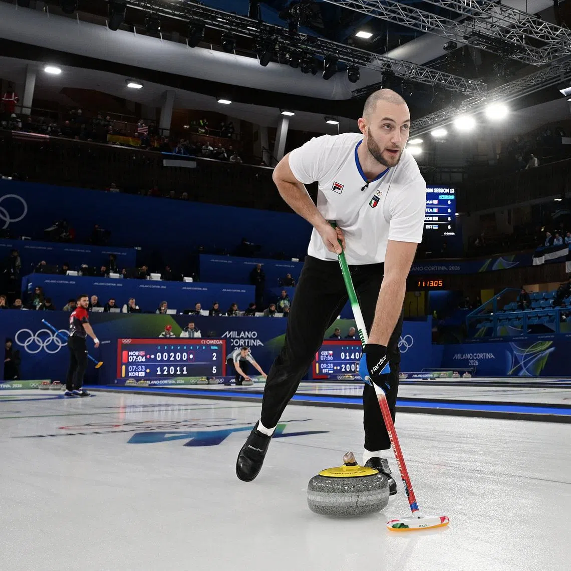 Milano Cortina 2026 Olympics - Curling - Mixed Doubles Round Robin Session 13 - United States of America vs Italy - Cortina Curling Olympic Stadium, Cortina d'Ampezzo, Italy - February 09, 2026. Amos Mosaner of Italy in action with Stefania Constantini of Italy against Korey Dropkin of United States and Cory Thiesse of United States REUTERS/Jennifer Lorenzini