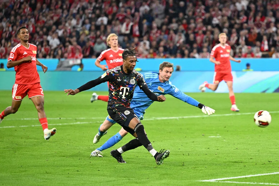 Bayern Munich’s Michael Olise scores their sixth goal.