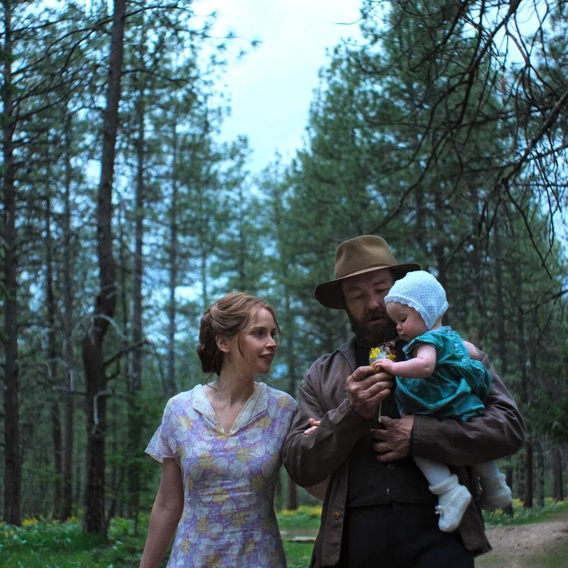 Felicity Jones (left) as Gladys and Joel Edgerton (centre) as Robert Grainier in Train Dreams.