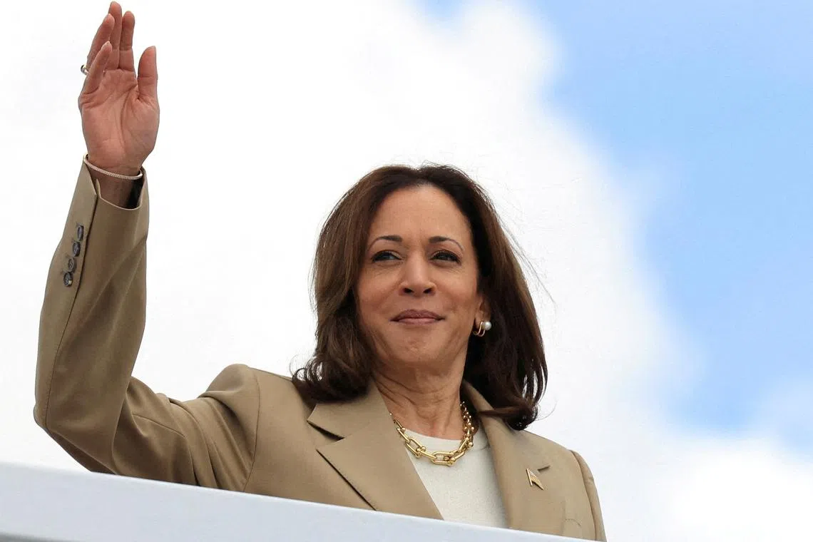 FILE PHOTO: U.S. Vice President Kamala Harris waves as she boards Air Force Two to depart on campaign travel to Philadelphia, Pennsylvania, at Joint Base Andrews, Maryland, U.S., July 13, 2024. REUTERS/Kevin Mohatt /File Photo