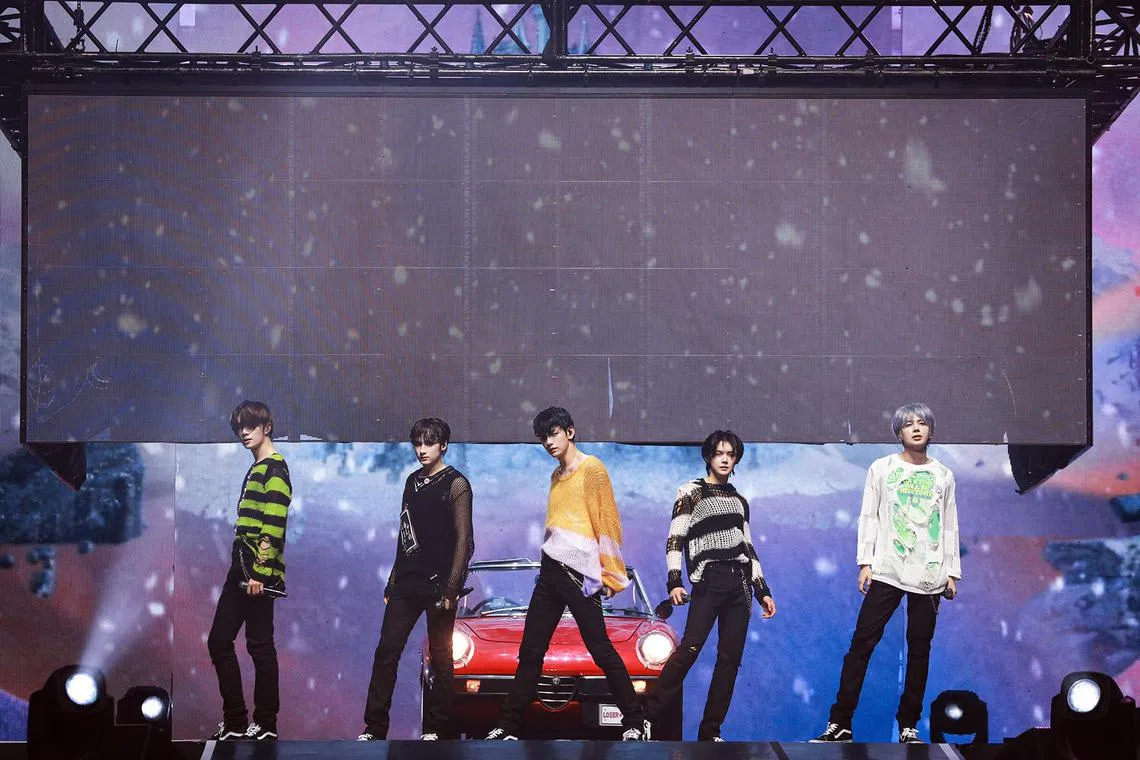 (From left) The members of TXT Beomgyu, Huening Kai, Soobin, Yeonjun and Taehyun during their sold-out concert at the Singapore Indoor Stadium on April 1.