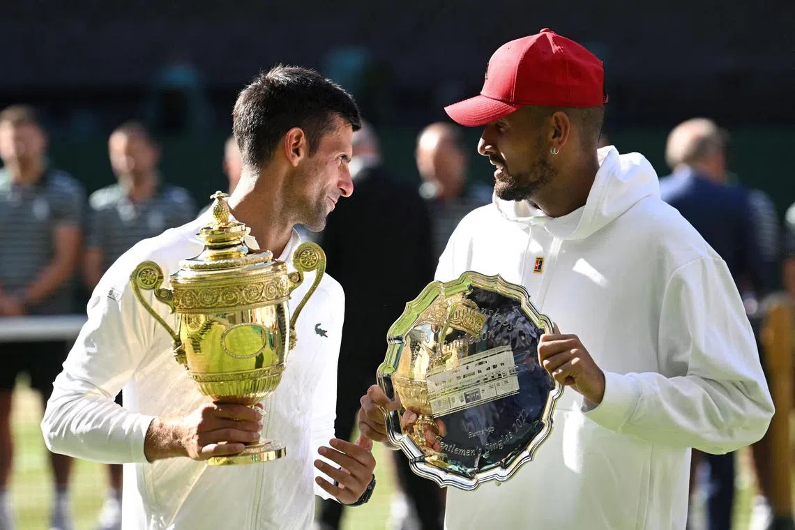 Serbia's Novak Djokovic with Australia's Nick Kyrgios after beating him in the Wimbledon final in July 2022. 