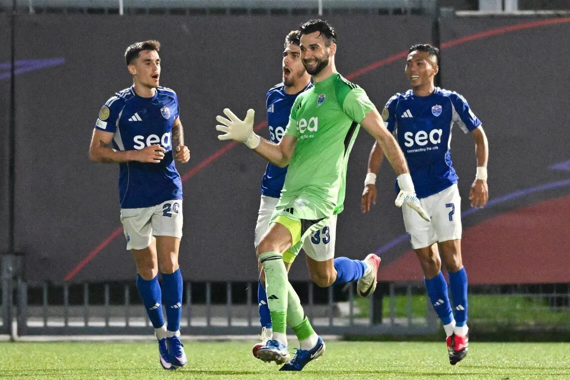 ST20260228-202678200828-Lim Yaohui-kksoc28/
Lion City Sailors goalkeeper Ivan Susak (in green) celebrating after helping to score a goal during the Singapore Premier League match between Lion City Sailors (in blue) and Albirex Niigata (in orange) during second half at Jurong East Stadium on Feb 28, 2026. It ended in a draw.
(ST PHOTO: LIM YAOHUI)