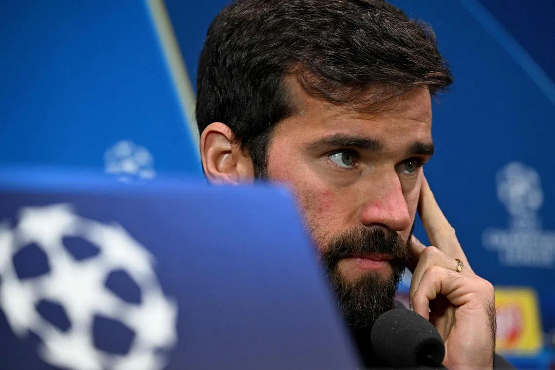 Liverpool's Brazilian goalkeeper Alisson Becker attending a press conference on the eve of the Champions League football match between AC Milan and Liverpool, at the San Siro stadium in Milan on Sept 16.