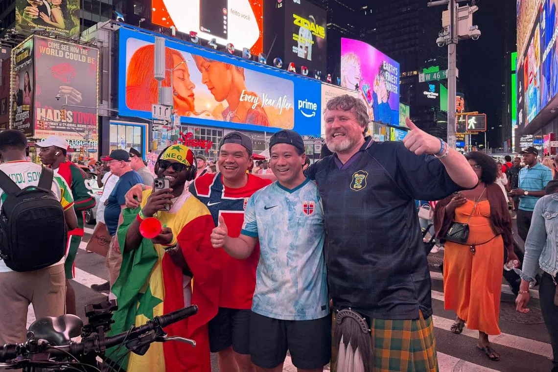 Football fans from around the world have invaded Times Square during the World Cup, making for a beautiful sight.