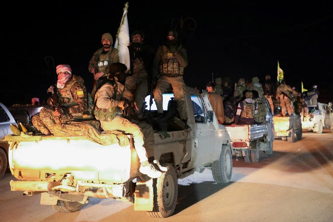 FILE PHOTO: Syrian Democratic Forces vehicles withdraw from the front lines following an agreement between the Syrian government and the Syrian Democratic Forces, in Hasakah, Syria February 10, 2026. REUTERS/Orhan Qereman/File Photo