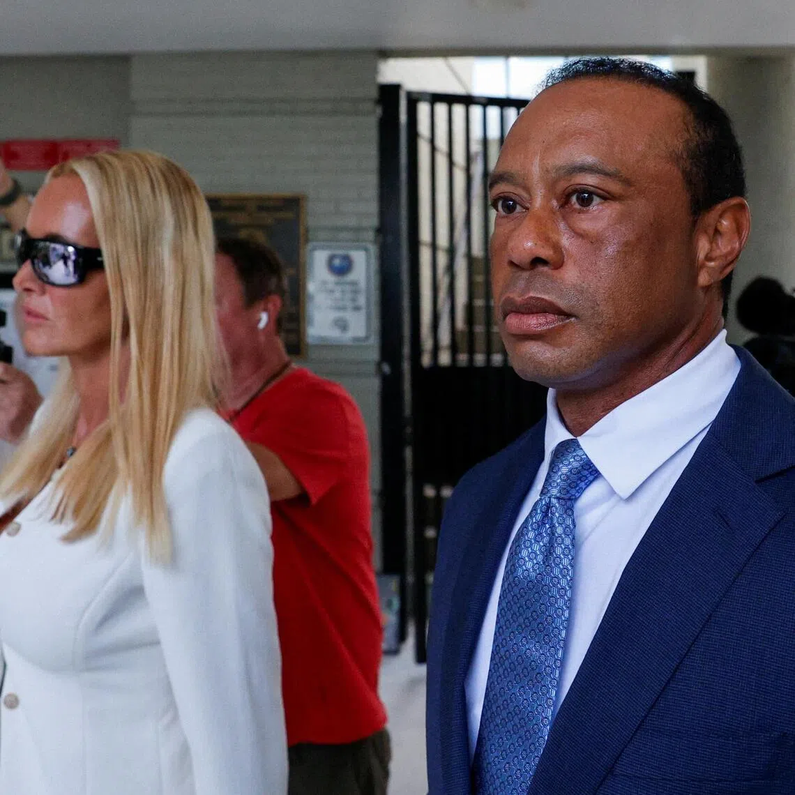 Golfer Tiger Woods (right), seen here leaving a court hearing on Sept 2 with his girlfriend Vanessa Trump, won the Players Championship twice, in 2001 and 2013.