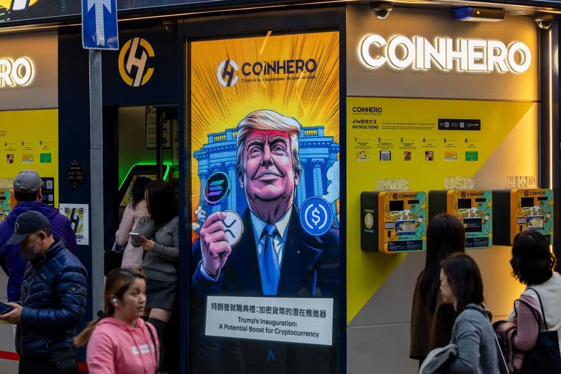 A cartoon image of US Presidentt Donald Trump with cryptocurrency tokens, depicted in front of the White House to mark his inauguration, displayed at a Coinhero store in Hong Kong on Jan. 20, 2025. 