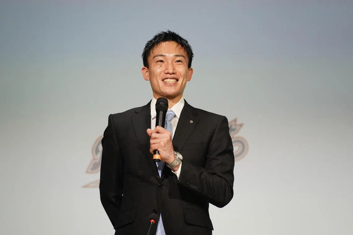 Kento Momota smiles as he attends a press conference to announce his retirement from Japan's national team in Tokyo on April 18, 2024.