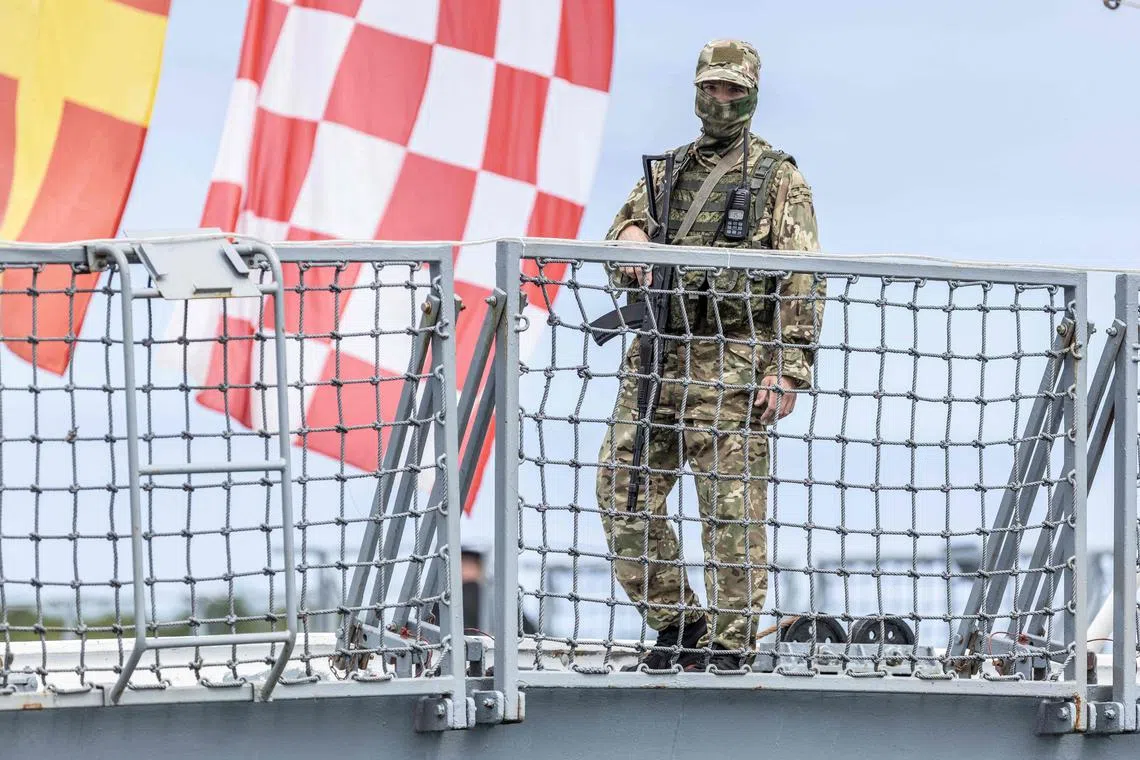 A soldier stands on board the Russian military frigate Admiral Gorshkov, docked at the port in Richards Bay, on Feb 22, 2023. 