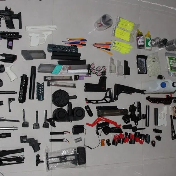 During the investigation, officers discovered a substantial cache of weapons and prohibited items in the unit.