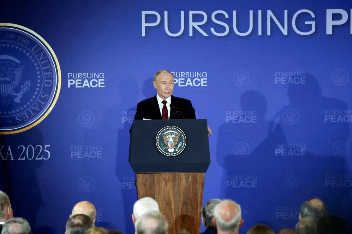 Russian President Vladimir Putin speaks as he holds a press conference with U.S. President Donald Trump (not pictured)  following their meeting to negotiate an end to the war in Ukraine, at Joint Base Elmendorf-Richardson in Anchorage, Alaska, U.S., August 15, 2025. REUTERS/Jeenah Moon