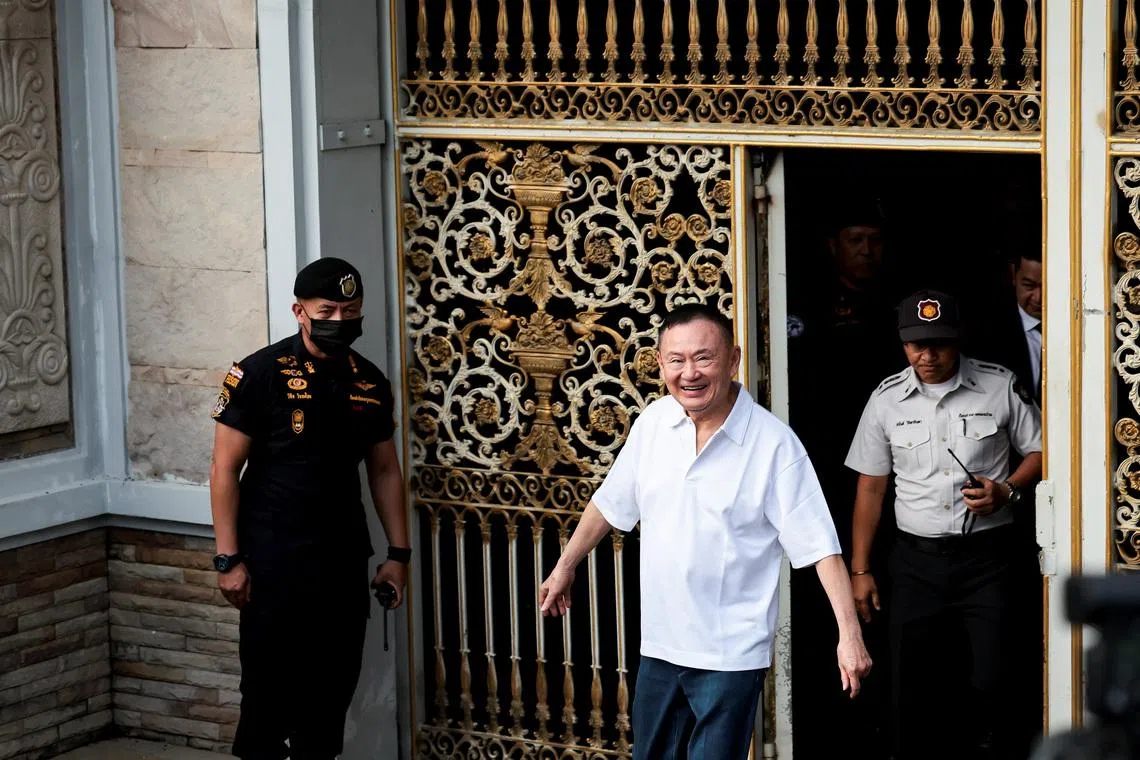 Former Thai Prime Minister Thaksin Shinawatra reacts following his release on parole after serving eight months of his one-year sentence at Klong Prem Central Prison, in Bangkok, Thailand, May 11, 2026. REUTERS/Chalinee Thirasupa