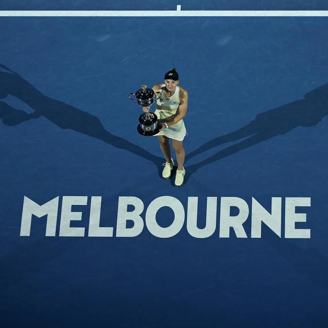 Elena Rybakina of Kazakhstan poses  with the Daphne Akhurst Memorial Cup after winning the Australian Open women's singles title. 