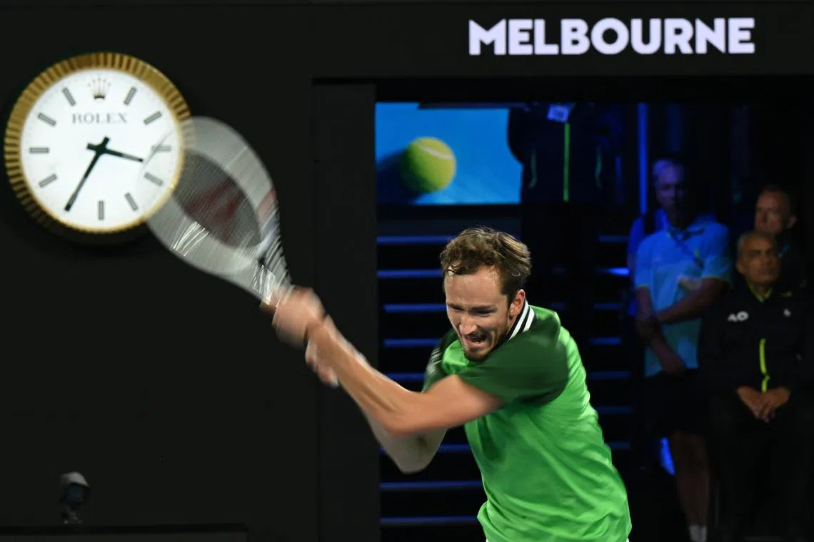 Daniil Medvedev of Russia in action as the clock shows past 3:30 am during his 2nd round match against Emil Ruusuvuori of Finland at the Australian Open in Melbourne.