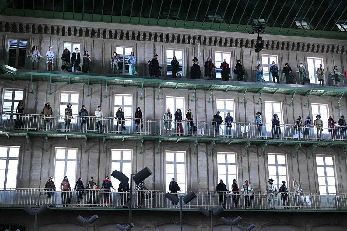 TOPSHOT - Models acknowledge the audience following the presentation of creations by Louis Vuitton for the Womenswear Ready-to-wear Fall-Winter 2025/2026 collection as part of the Paris Fashion Week, in Paris on March 10, 2025. (Photo by Bertrand GUAY / AFP)