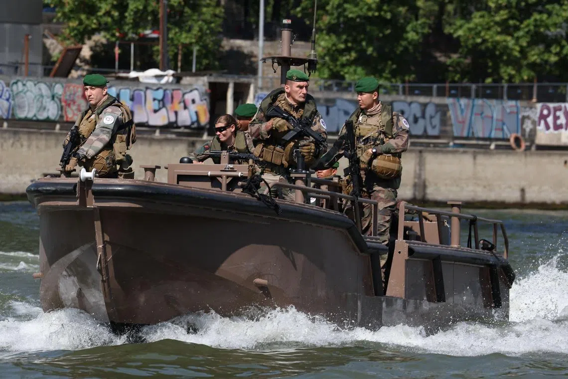 French soldiers patrolling the Seine River in Paris, on July 17, 2024.