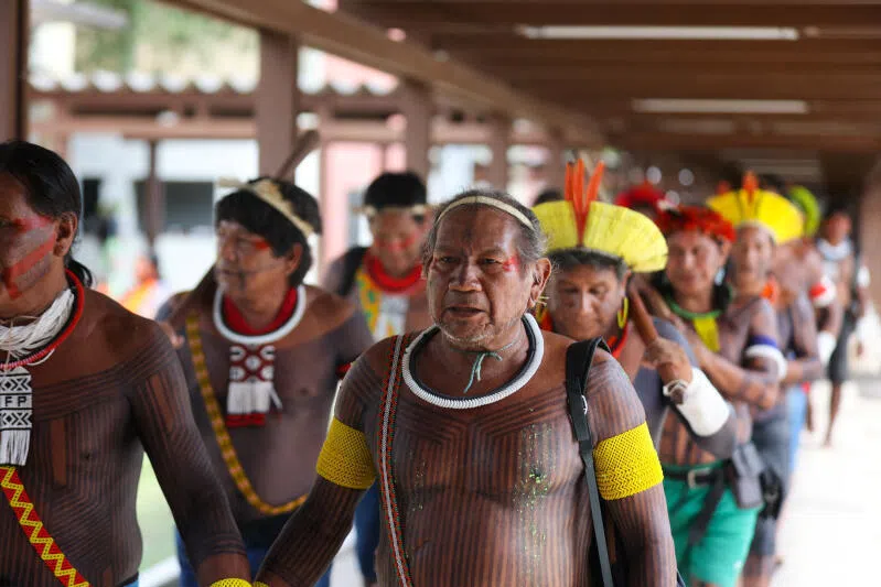 Indigenous people arrive at the Indigenous Camp on the day of the opening ceremony of COP30, in Belem, Brazil, on Nov 10.