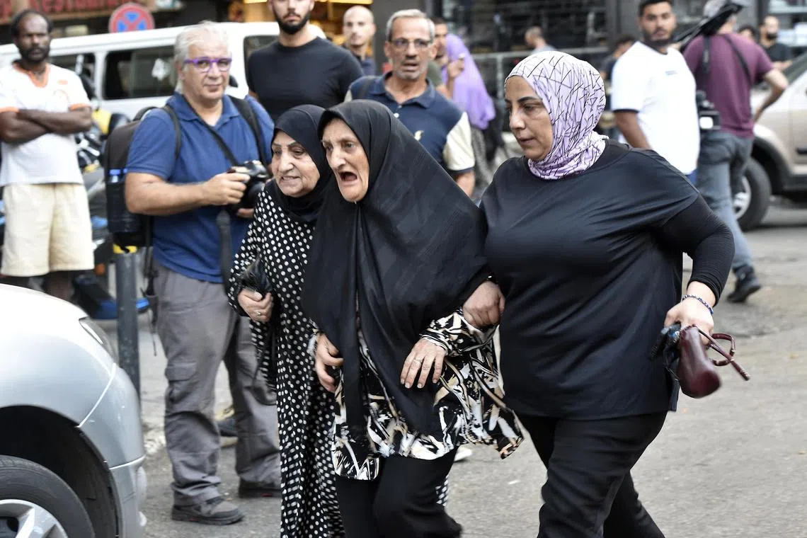 Friends and relatives of injured people arrive at a hospital in Beirut, after an incident in which pagers exploded simultaneously across Lebanon. 