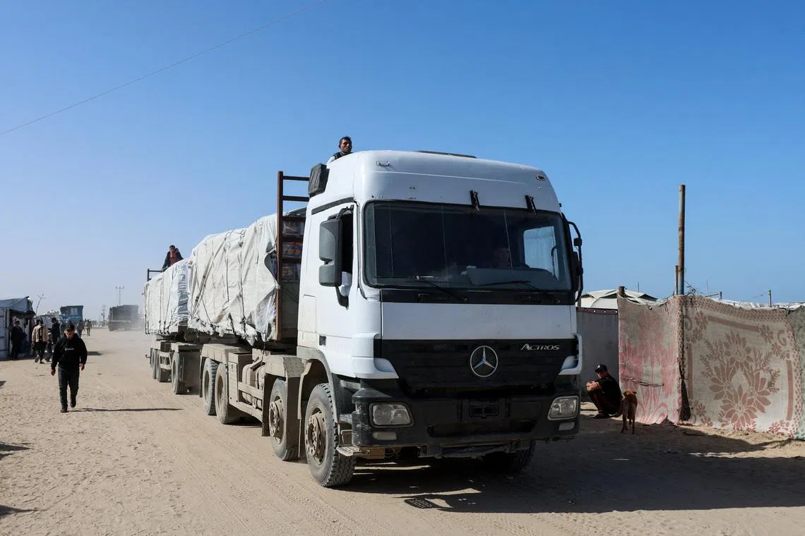 An aid truck moves on a road after entering Gaza through the Kerem Shalom crossing, in Rafah in the southern Gaza Strip, on Feb 1, 2026. 