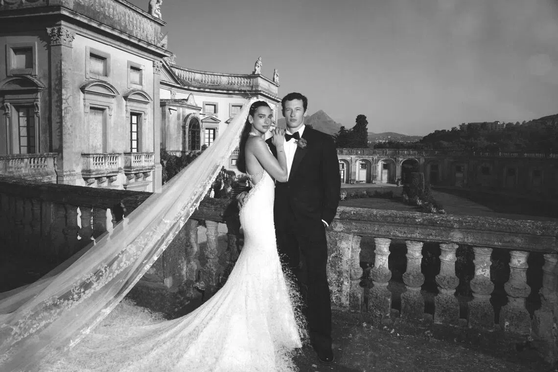 Dua Lipa in a custom haute couture wedding dress by Chanel. Groom Callum Turner wore bespoke Louis Vuitton.