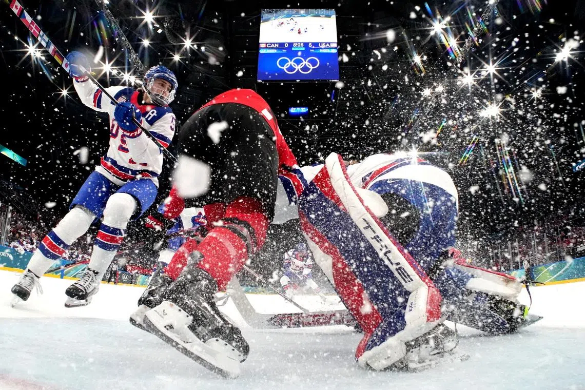 Milano Cortina 2026 Olympics - Ice Hockey - Women's Preliminary Round - Group A - Canada vs United States - Milano Santagiulia Ice Hockey Arena, Milan, Italy - February 10, 2026. Megan Keller of United States and Aerin Frankel of United States in action with a member of team Canada REUTERS/Mike Segar/Pool     TPX IMAGES OF THE DAY