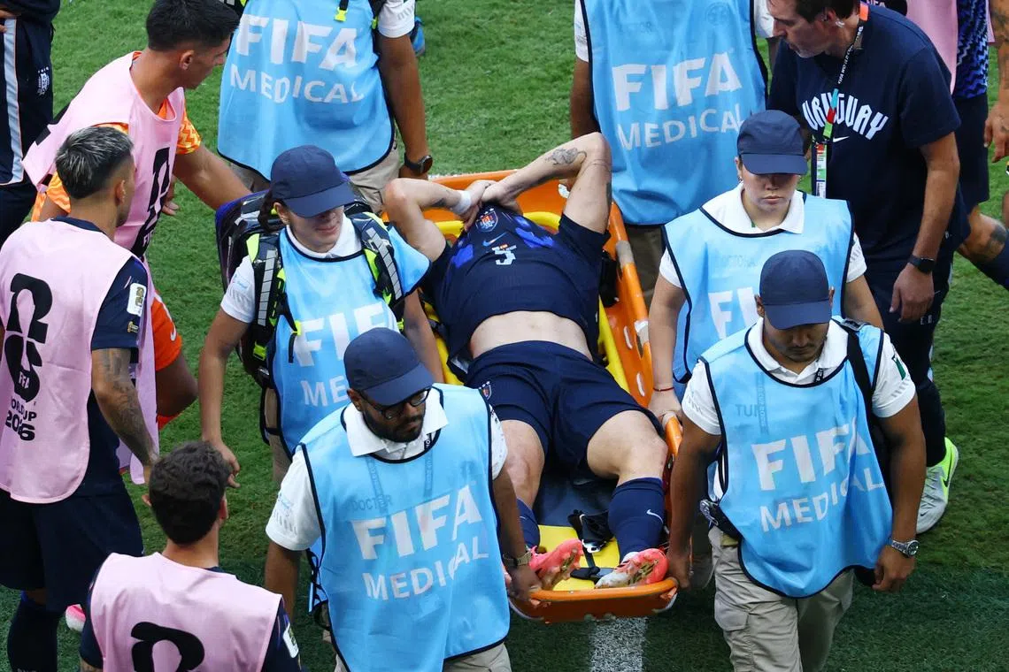 Soccer Football - FIFA World Cup 2026 - Group H - Uruguay v Spain - Estadio Guadalajara, Guadalajara, Mexico - June 26, 2026 Uruguay's Manuel Ugarte looks dejected as he is stretchered off after sustaining an injury REUTERS/Raquel Cunha