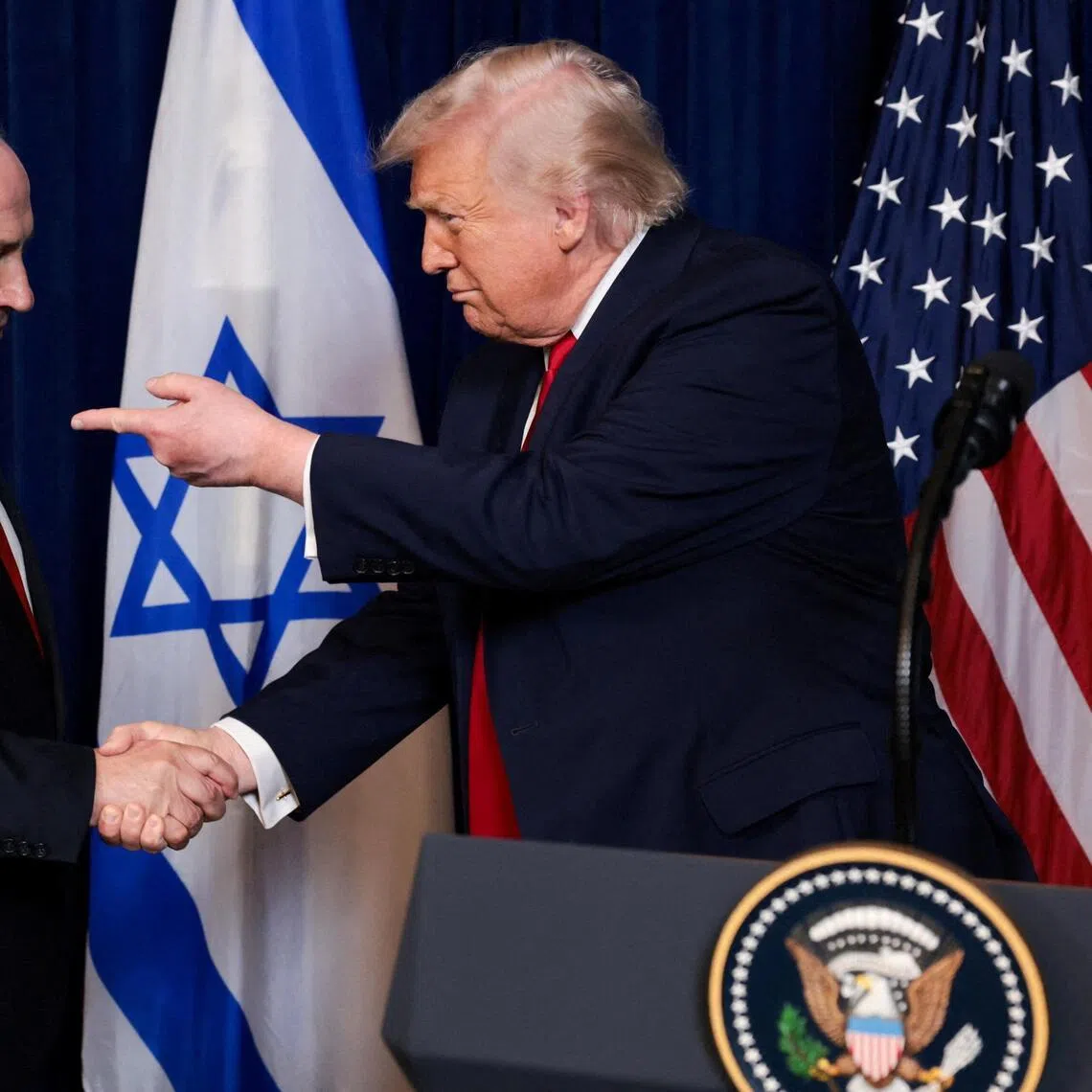 Israeli Prime Minister Benjamin Netanyahu (left) and US President Donald Trump taking part in a press conference in Florida, in December 2025.