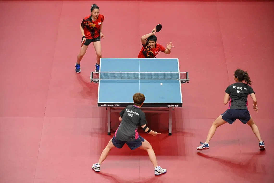 Loy Ming Ying (right) and Ser Lin Qian of Singapore in action against Doo Hoi Kem and Ng Wing Lam of China during the Asian Games Table Tennis women’s doubles quarter-finals at Sky Hall Toyota on Sept 26.