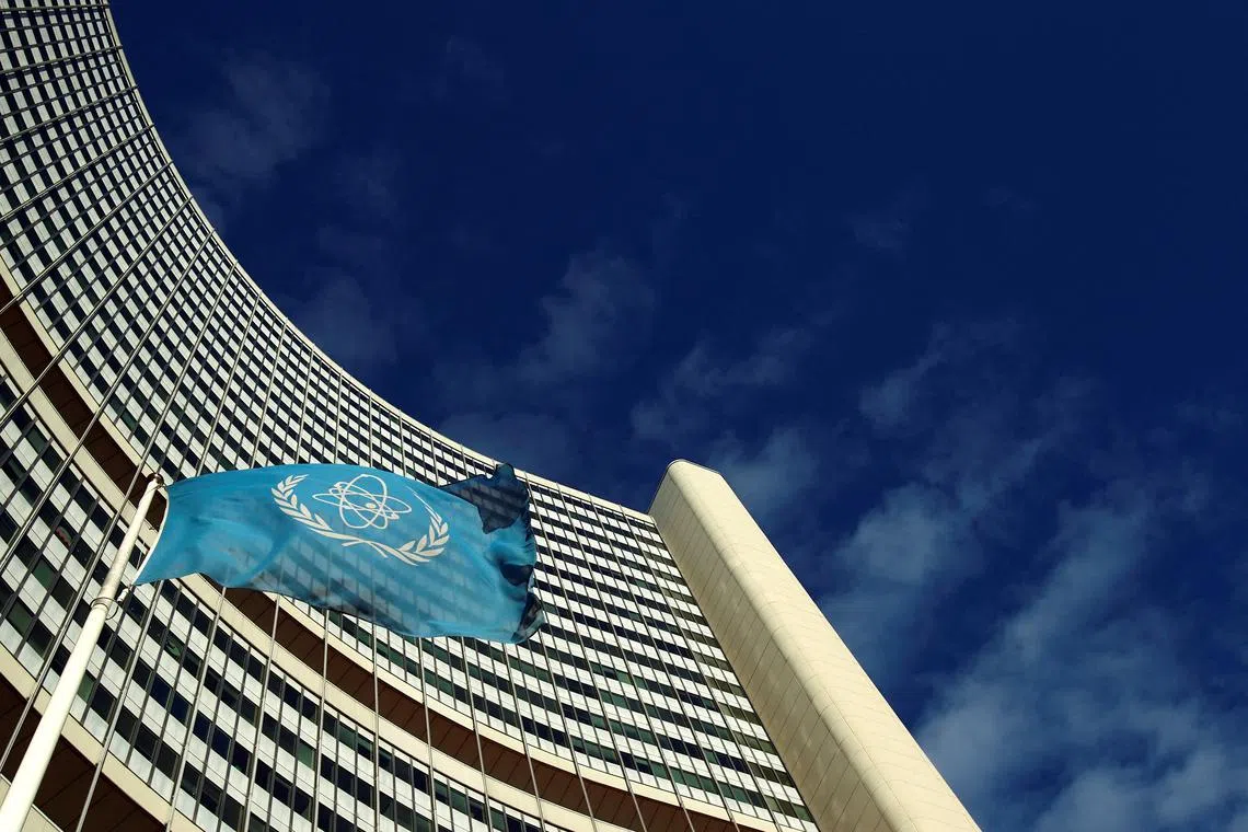 FILE PHOTO: The flag of the International Atomic Energy Agency (IAEA) flies in front of its headquarters during a board of governors meeting in Vienna November 28, 2013. REUTERS/Heinz-Peter Bader/File Photo