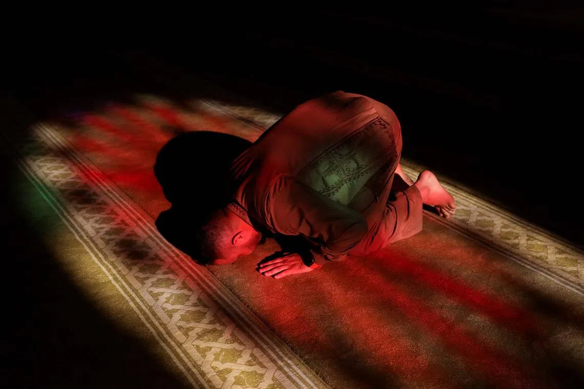 A Muslim attending the Eid al-Fitr prayer, marking the end of the fasting month of Ramadan, in Hasakah, Syria, March 31, 2025. 