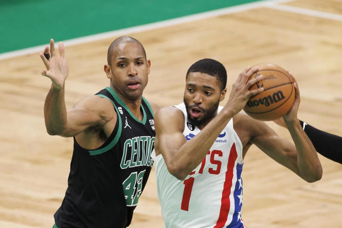 Brooklyn Nets forward Mikal Bridges drives to the basket past Boston Celtics centre Al Horford during the first half at the TD Garden in Boston.