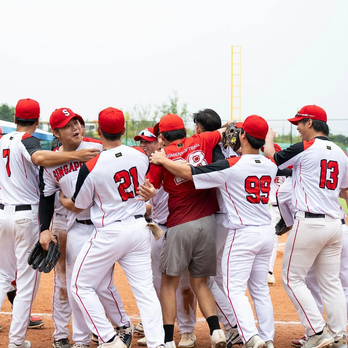 The men's softball national team from Singapore celebrate after they defeated two-time world champions Australia at the World Games on Aug 6 


Credit : Matthew Lim