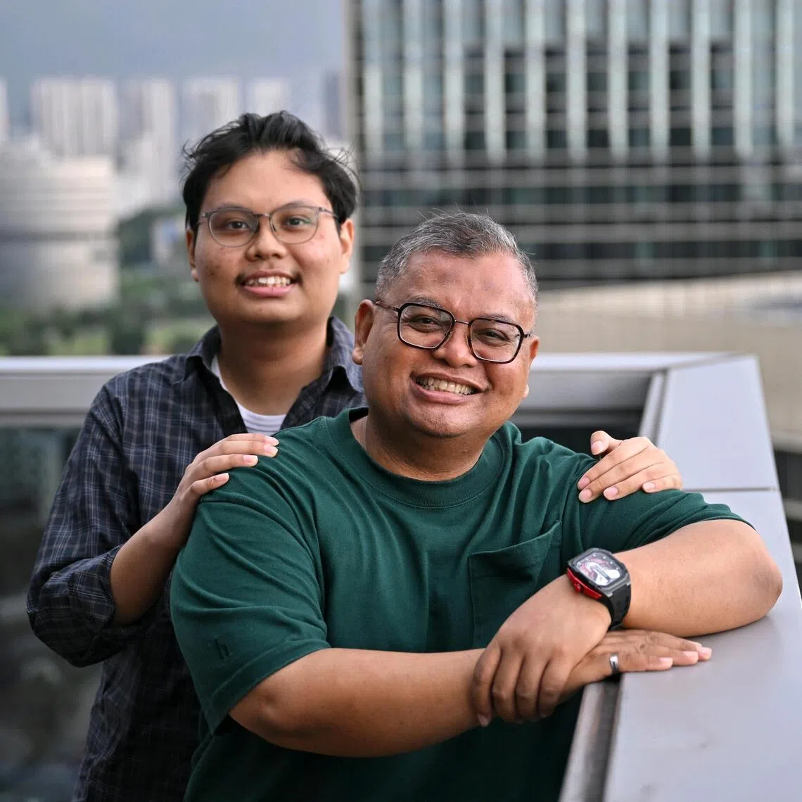 Muhammad Irfan Bin Mohamed Awi (front, in green) became closer to his son Muhammad Danish Bin Muhammad Irfan after caring for him  when he had cancer. 