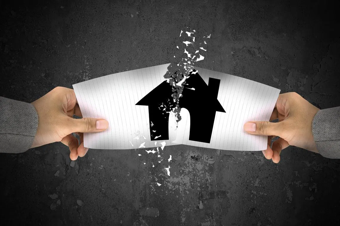 Businessman stress, ripping up a house paper..