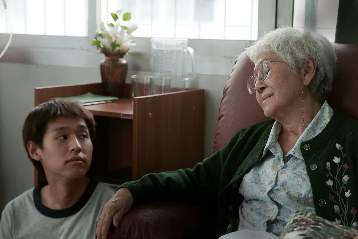 Putthipong “Billkin” Assaratanakul (left) and Usha Seamkhum in How To Make Millions Before Grandma Dies