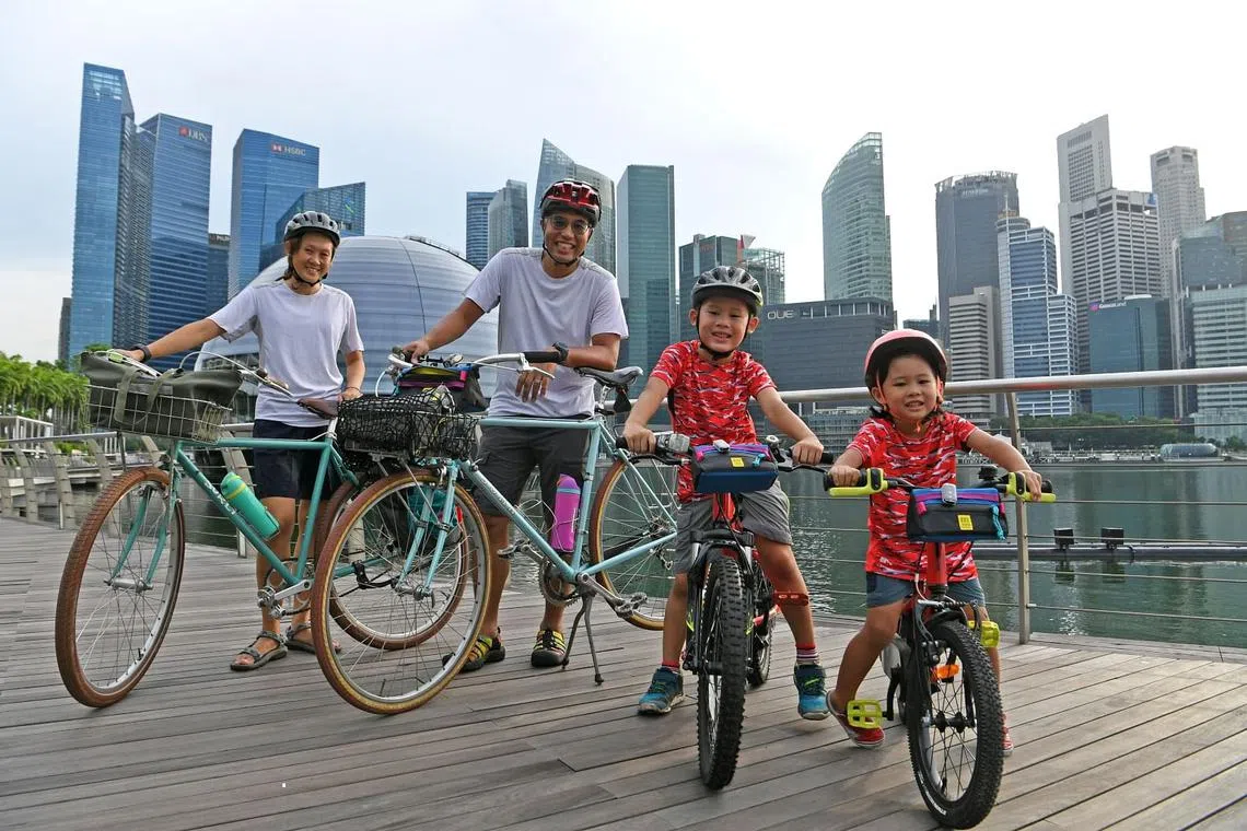 Cycling coach Muhammad Rezal Ramli and his wife Chew Pei Wen, with their son Muhammad Rayan and daughter Nora.