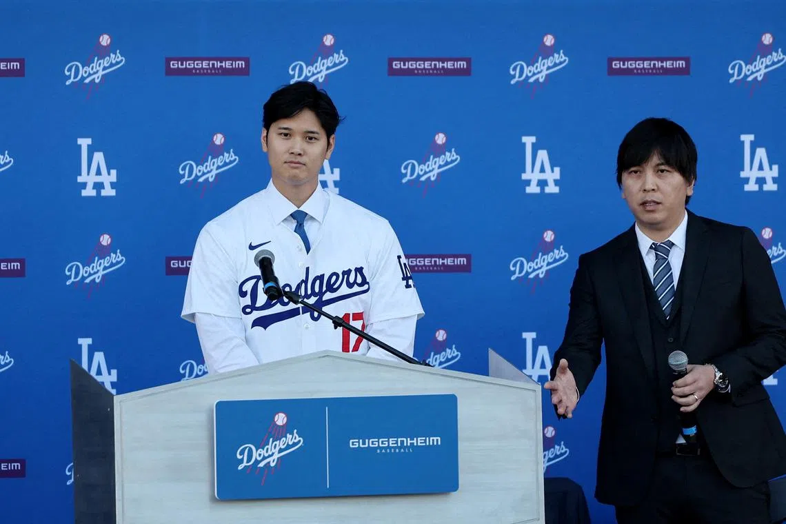 FILE PHOTO: Baseball - Shohei Ohtani Press Conference - Centerfield Plaza, Dodger Stadium, Los Angeles, California, United States - December 14, 2023 Shohei Ohtani with interpreter Ippei Mizuhara during the press conference REUTERS/Aude Guerrucci/File Photo