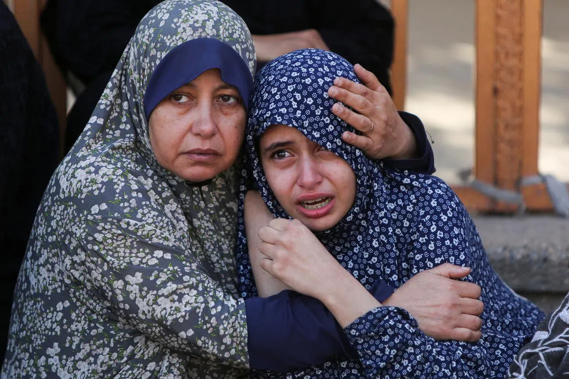 Women react following the death of Palestinians, in what the Gaza health ministry say was Israeli fire near a distribution site in Rafah, at Nasser hospital in Khan Younis, in the southern Gaza Strip, June 3, 2025. REUTERS/Hatem Khaled     TPX IMAGES OF THE DAY