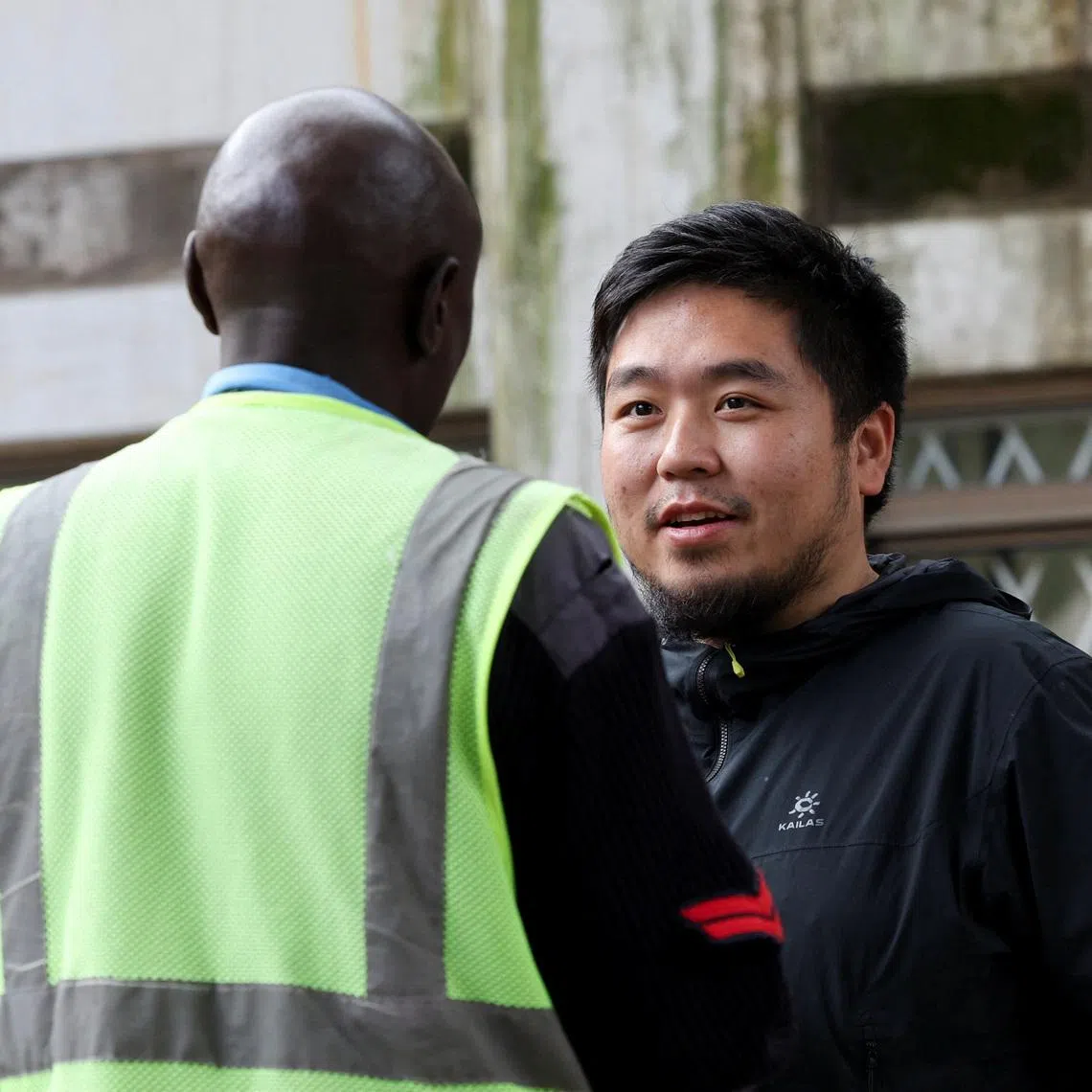 Chinese national Zhang Kequn stands outside the courtroom before his sentencing, after he pleaded guilty to charges of dealing with wildlife species without a permit and illegal possession of garden ants, on the day he was fined U.S. dollars 7,746 and a one year jail term, at the Jomo Kenyatta International Airport (JKIA) Law Courts, in Nairobi, Kenya, April 15, 2026. REUTERS/Monicah Mwangi